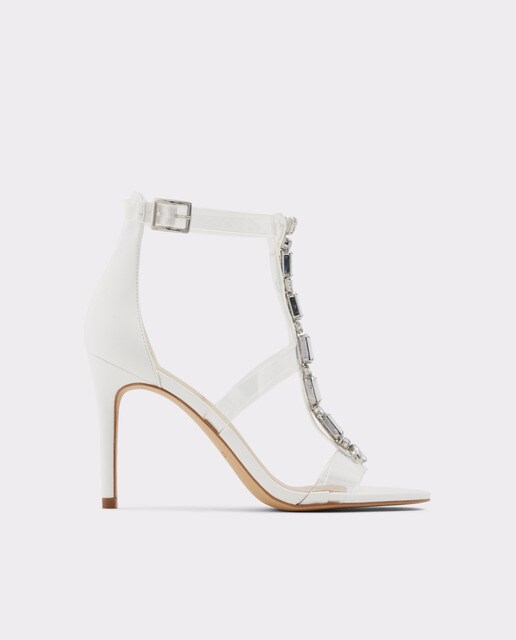 Sandalias de tacón de mujer Aldo en color blanco con tiras transparentes y pedrería