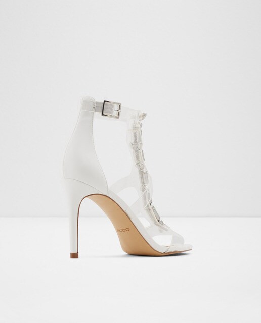 Sandalias de tacón de mujer Aldo en color blanco con tiras transparentes y pedrería