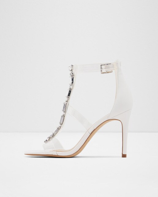 Sandalias de tacón de mujer Aldo en color blanco con tiras transparentes y pedrería