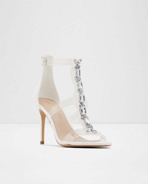 Sandalias de tacón de mujer Aldo en color blanco con tiras transparentes y pedrería