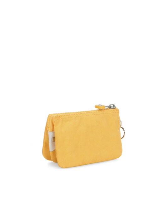 Monedero de mujer Kipling multiusos en color amarillo