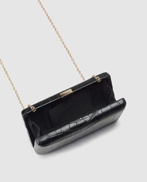 Clutch de fiesta El Corte Inglés en negro con grabado coco