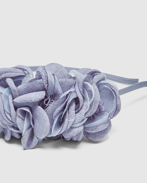 Diadema de niña azul con flores