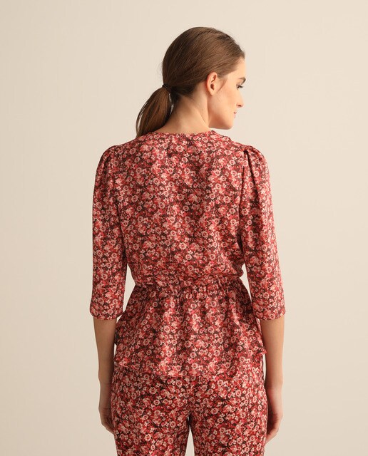 Blusa cruzada de mujer con peplum