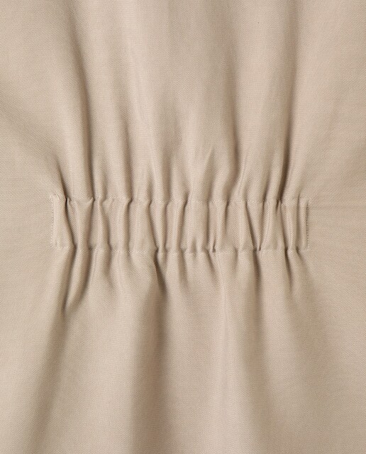 Chaleco beige de mujer con doble botón