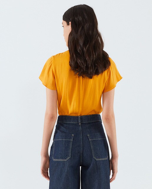 Blusa lisa de mujer manga volante
