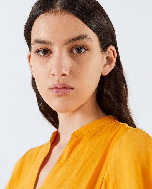 Blusa lisa de mujer manga volante