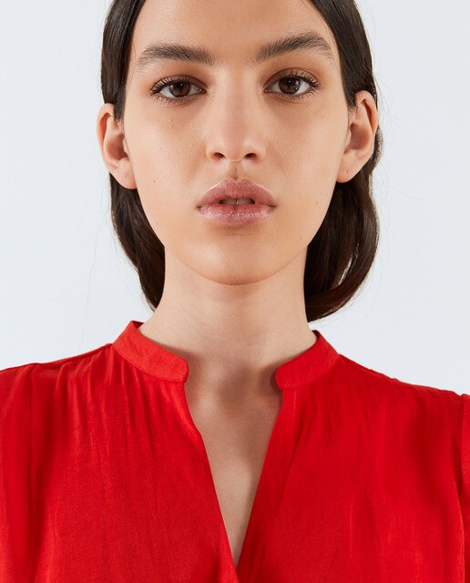 Blusa lisa de mujer manga volante