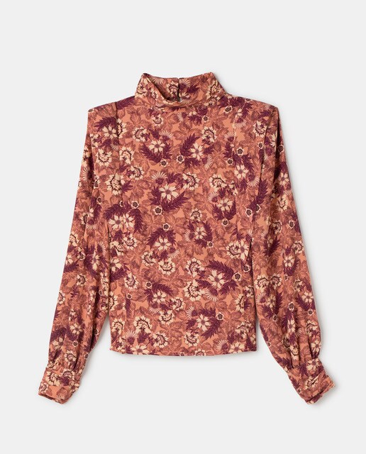 Blusa de mujer con hombreras y cuello alto