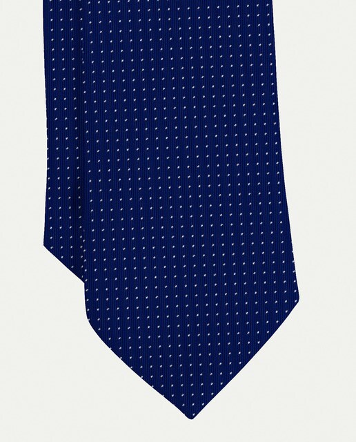 Corbata de seda lunares siete pliegues, de color azul marino.