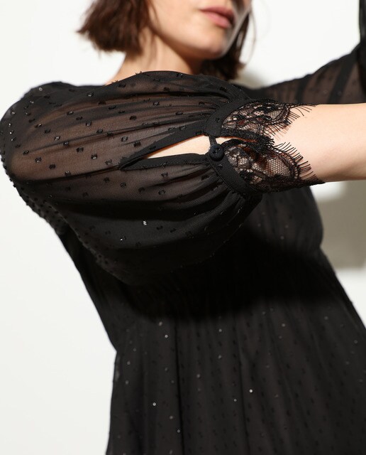 Vestido de fiesta con plumeti