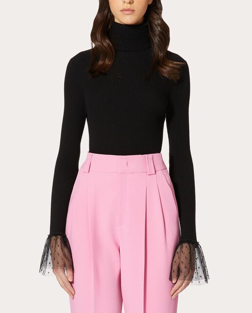 Jersey cuello alto con volantes