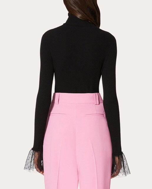 Jersey cuello alto con volantes