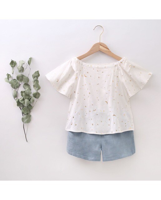 Blusa de niña de cuello barco con estampado de estrellas y lunas · Dadati · El  Corte Inglés