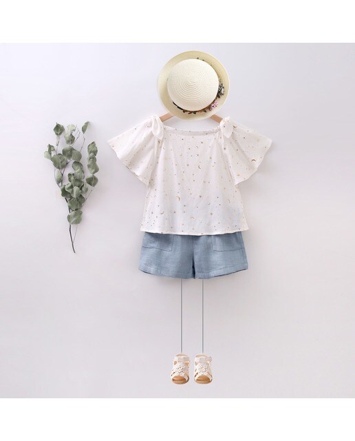 Blusa de niña de cuello barco con estampado de estrellas y lunas · Dadati · El  Corte Inglés