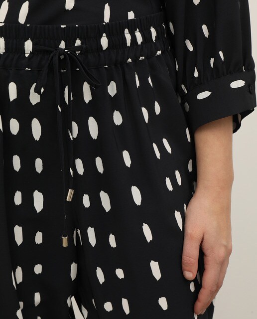 Pantalón fluido de mujer talla grande lunares · Couchel · El Corte Inglés