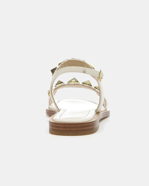 Sandalia plana Wren en piel y logotipo con apliques en pirámide. · Michael  Michael Kors · El Corte Inglés