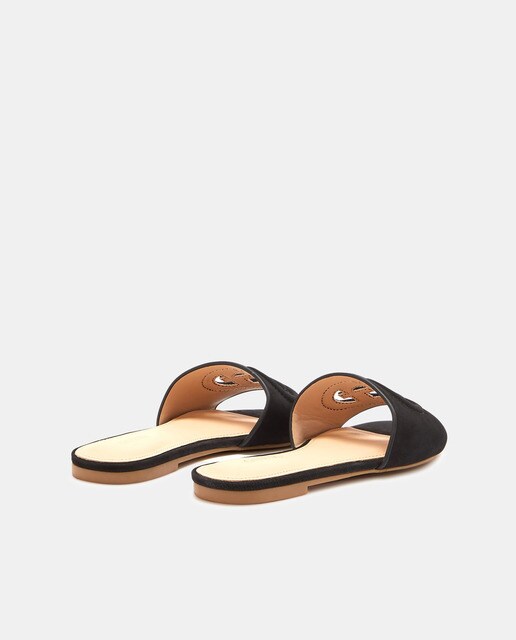 Sandalias planas de mujer en piel de color negro · Guess · El Corte Inglés