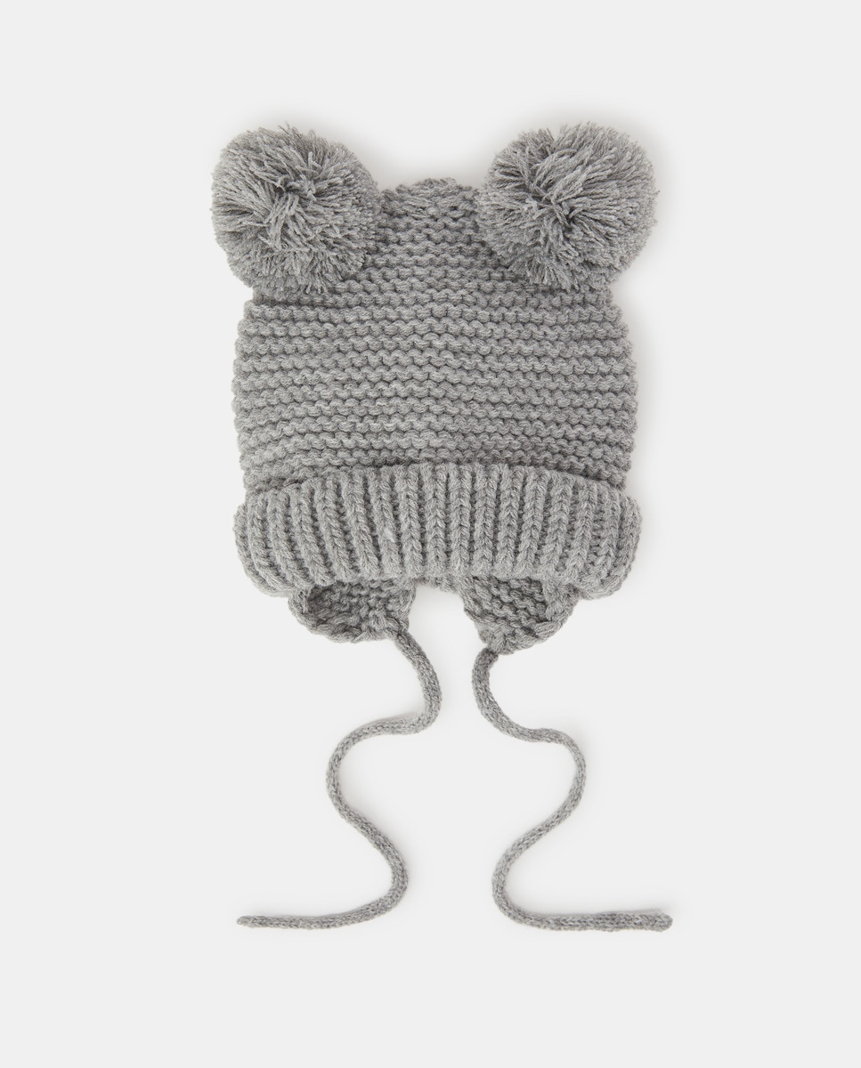 Bonnet en maille à pompons