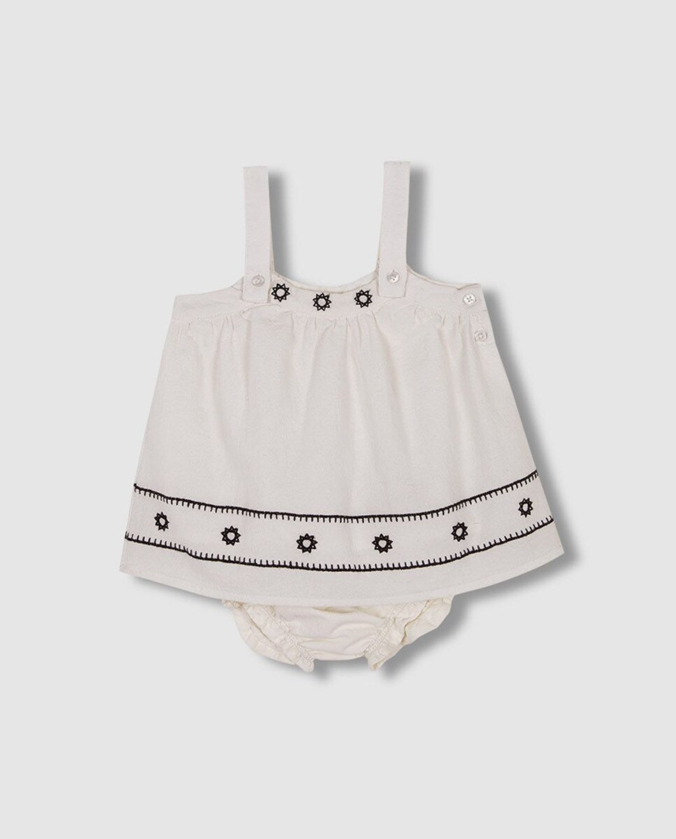 Robe salopette avec broderies contrastantes