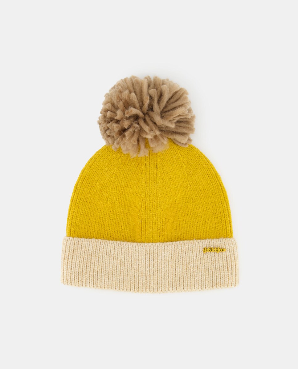 Bonnet en maille à pompon