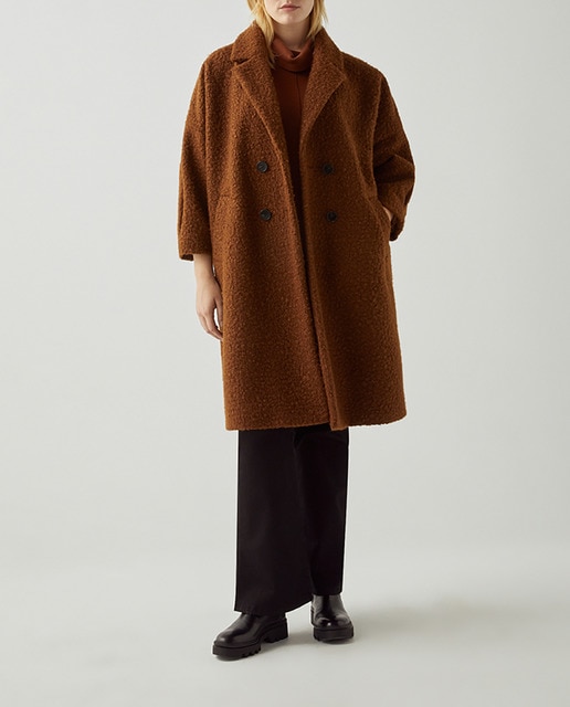 Imagen 0 de Abrigo de mujer bucle con dos bolsillos