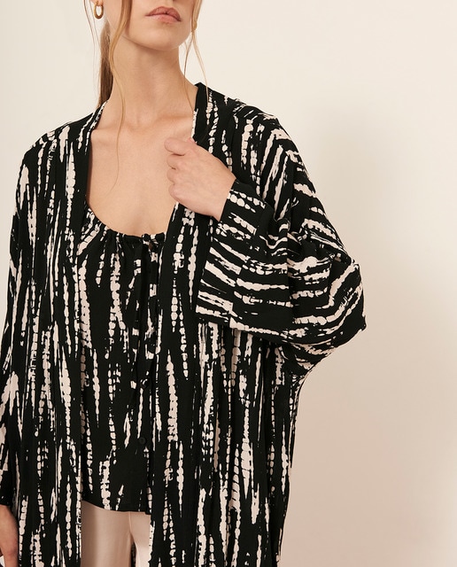 Imagen 0 de Top con tirantes y lazo en el pecho