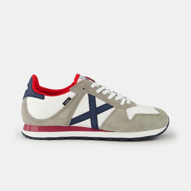 Imagen 0 de Zapatillas de hombre en blanco bajas tipo running con logotipo lateral y detalles en contraste
