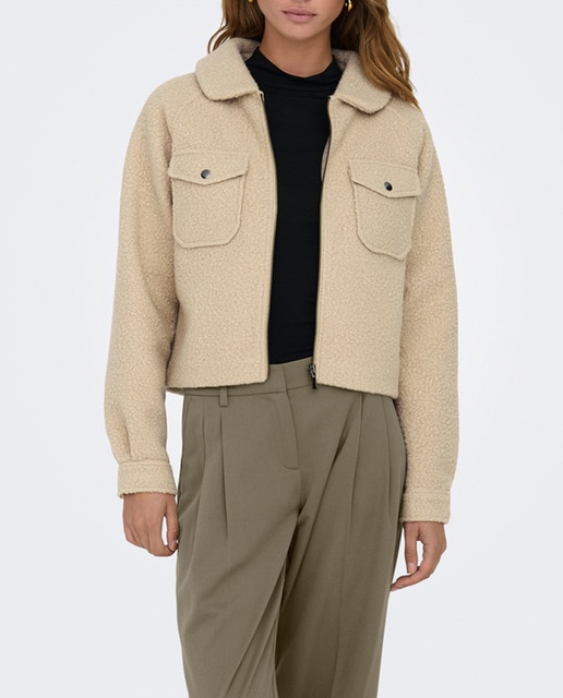 Imagen 0 de Abrigo de mujer con cremallera y bolsillos delanteros.