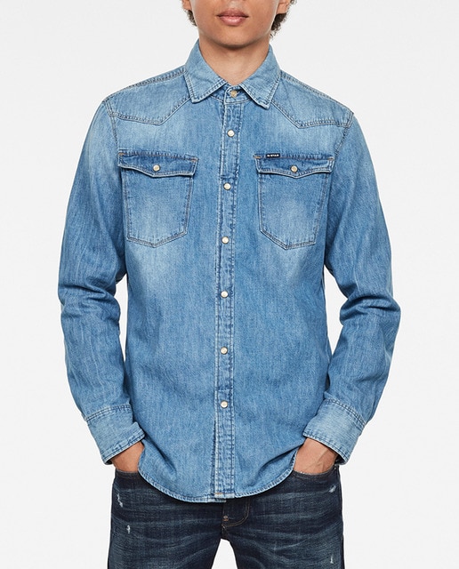 Imagen 0 de Camisa de hombre vaquera slim azul con cierre de botones y bolsillos