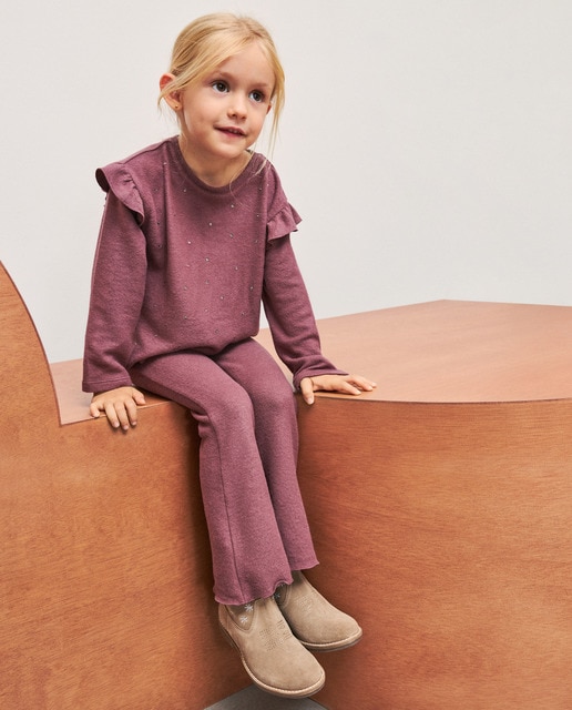 Imagem 0 de Conjunto de Malha Cortado com Top com Strass e Folho e Calças Flare