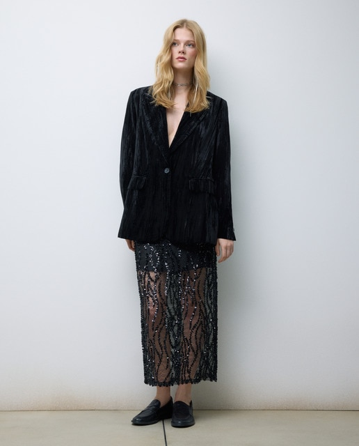 Imagen 0 de Falda midi con transparecias y lentejuelas