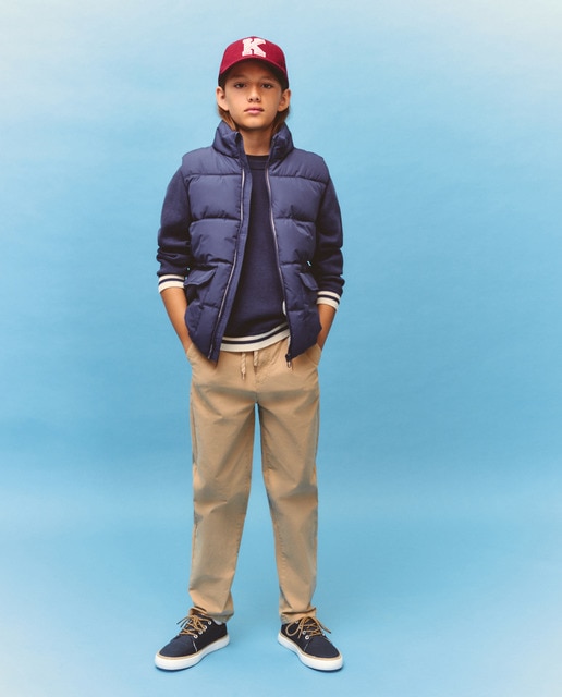 Imagem 0 de Calças Lisas com Elásticos e Botão