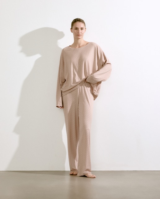 Imagem 0 de Calças Largas com Estampado de Monograma Integral no Tom - Bege