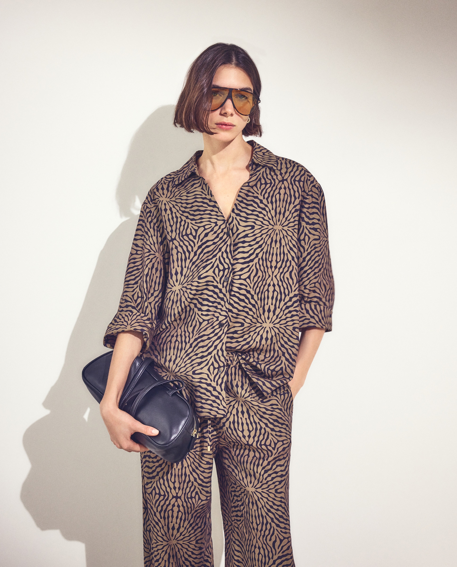 Imagem 0 de Top Tipo Polo com Animal Print